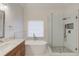 Spa-like bathroom with a freestanding soaking tub and a large shower at 3640 Rolling Creek Dr, Buford, GA 30519