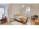 Cozy bedroom with a charming sitting area and hardwood floors at 3640 Rolling Creek Dr, Buford, GA 30519