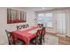 Charming dining area with a table for six and an adjacent living space at 3640 Rolling Creek Dr, Buford, GA 30519