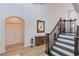 Bright entryway with hardwood floors and elegant staircase at 3640 Rolling Creek Dr, Buford, GA 30519