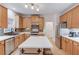 Modern kitchen with light wood cabinets, quartz countertops, and stainless steel appliances at 3640 Rolling Creek Dr, Buford, GA 30519