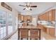 Eat-in kitchen with light wood cabinets, an island, and access to a deck at 3640 Rolling Creek Dr, Buford, GA 30519