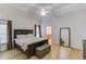 Spacious main bedroom with hardwood floors, large windows and a king-size bed at 3640 Rolling Creek Dr, Buford, GA 30519