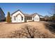 House backyard view, featuring a screened porch and grassy yard at 4983 Kyle Dr, Powder Springs, GA 30127