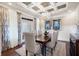 Elegant dining room with coffered ceiling and hardwood floors at 4983 Kyle Dr, Powder Springs, GA 30127