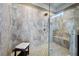 Spa-like shower with multiple shower heads and built-in seat at 4983 Kyle Dr, Powder Springs, GA 30127