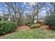 Landscaped backyard with mature trees and privacy fence at 975 Seaboard Nw Ave, Atlanta, GA 30318