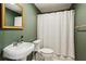 Clean bathroom with pedestal sink and shower/tub combo at 975 Seaboard Nw Ave, Atlanta, GA 30318