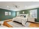 Spacious bedroom with green walls and king-size bed at 975 Seaboard Nw Ave, Atlanta, GA 30318