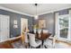 Elegant dining room with dark wood table and light chairs at 975 Seaboard Nw Ave, Atlanta, GA 30318