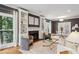 Bright living room with fireplace and built-in shelving at 975 Seaboard Nw Ave, Atlanta, GA 30318