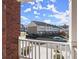 View from balcony overlooking townhomes and a partly cloudy sky at 2277 Hawks Bluff Trl, Lawrenceville, GA 30044