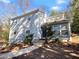 Charming two-story home with gray siding and a landscaped yard at 6049 Shallow Wood Ct, Douglasville, GA 30135