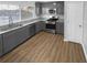 Modern gray kitchen with granite countertops and stainless steel appliances at 6049 Shallow Wood Ct, Douglasville, GA 30135