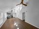 Open concept kitchen and living area with hardwood floors and modern finishes at 6049 Shallow Wood Ct, Douglasville, GA 30135