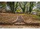 Stone steps leading up a sloped backyard at 1098 Jefferson Ave, East Point, GA 30344