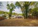 Overgrown backyard with a view of neighboring houses at 1098 Jefferson Ave, East Point, GA 30344