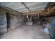 Unfinished basement with exposed utilities and concrete floor at 1098 Jefferson Ave, East Point, GA 30344