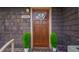 Charming front door with wood detailing and potted plants at 1098 Jefferson Ave, East Point, GA 30344