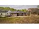 House exterior showcasing a brown shingled home with a yard at 1098 Jefferson Ave, East Point, GA 30344