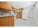 Small basement kitchenette with wood cabinets and appliances at 127 Ennisbrook Se Dr, Smyrna, GA 30082