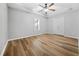 Basement bedroom with hardwood floors and double doors at 127 Ennisbrook Se Dr, Smyrna, GA 30082