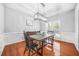 Dining room with hardwood floors, chandelier, and wainscoting at 127 Ennisbrook Se Dr, Smyrna, GA 30082