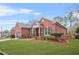 Brick ranch home with landscaped yard, attached garage, and inviting front porch at 127 Ennisbrook Se Dr, Smyrna, GA 30082