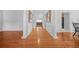 Hardwood floor hallway with high ceilings and columns leading to other rooms at 127 Ennisbrook Se Dr, Smyrna, GA 30082