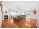 Living room with hardwood floors, fireplace, and large windows at 127 Ennisbrook Se Dr, Smyrna, GA 30082