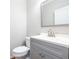 Modern bathroom with gray vanity and updated fixtures at 230 Ascott Ln, Woodstock, GA 30189