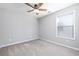 Cozy bedroom featuring a ceiling fan and window at 230 Ascott Ln, Woodstock, GA 30189