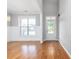 Bright entryway with hardwood floors and white trim at 230 Ascott Ln, Woodstock, GA 30189