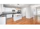 Kitchen with white cabinets, granite counters, and island at 230 Ascott Ln, Woodstock, GA 30189