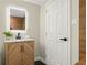 Basement bathroom with modern vanity and a lighted mirror at 2716 Riggs Dr, East Point, GA 30344