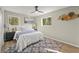 Cozy bedroom with plush bedding, ceiling fan, and ample natural light at 2716 Riggs Dr, East Point, GA 30344