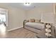 Cozy bedroom with daybed and wood-look floors at 2805 Ellis Pointe Ave, Conyers, GA 30094