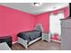 Small bedroom with pink walls and a single bed at 2805 Ellis Pointe Ave, Conyers, GA 30094