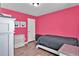 Cozy bedroom with pink walls and a single bed at 2805 Ellis Pointe Ave, Conyers, GA 30094