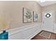 Bright and airy entryway with wainscoting and hardwood floors at 2805 Ellis Pointe Ave, Conyers, GA 30094