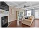 Living room features hardwood floors, a fireplace and coffered ceilings at 2805 Ellis Pointe Ave, Conyers, GA 30094