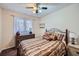 Bedroom with dresser, double bed, and ceiling fan at 1803 Ashborough Way # Apt F, Marietta, GA 30067