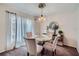 Dining room with glass table, four chairs, and chandelier at 1803 Ashborough Way # Apt F, Marietta, GA 30067