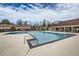 Community swimming pool with adjacent clubhouse at 1803 Ashborough Way # Apt F, Marietta, GA 30067