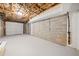 Unfinished basement featuring exposed ceiling, cement block walls, and garage door at 2480 Melody Nw Ln, Kennesaw, GA 30152