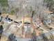 Aerial view showcasing house and large backyard in wooded neighborhood at 123 Hollow Springs Dr, Hiram, GA 30141