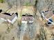 Aerial view of house with large backyard, surrounded by trees and other houses at 123 Hollow Springs Dr, Hiram, GA 30141