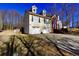 Side view of a two-story house with a two-car garage at 123 Hollow Springs Dr, Hiram, GA 30141