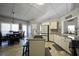 Bright kitchen featuring white cabinetry, granite countertops, stainless steel appliances and a breakfast area at 123 Hollow Springs Dr, Hiram, GA 30141