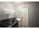 A laundry room featuring a white washer and dryer set next to a white door at 123 Hollow Springs Dr, Hiram, GA 30141